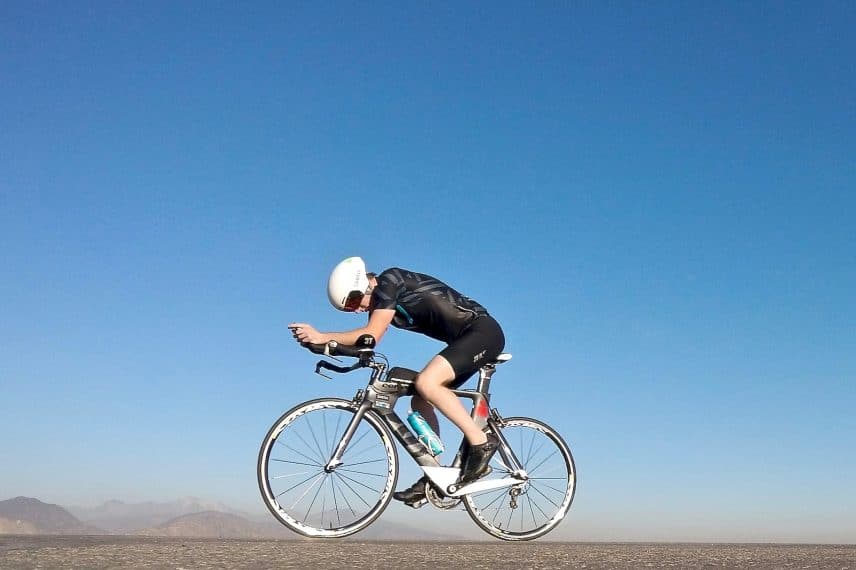 man riding on gray road bicycle during daytime